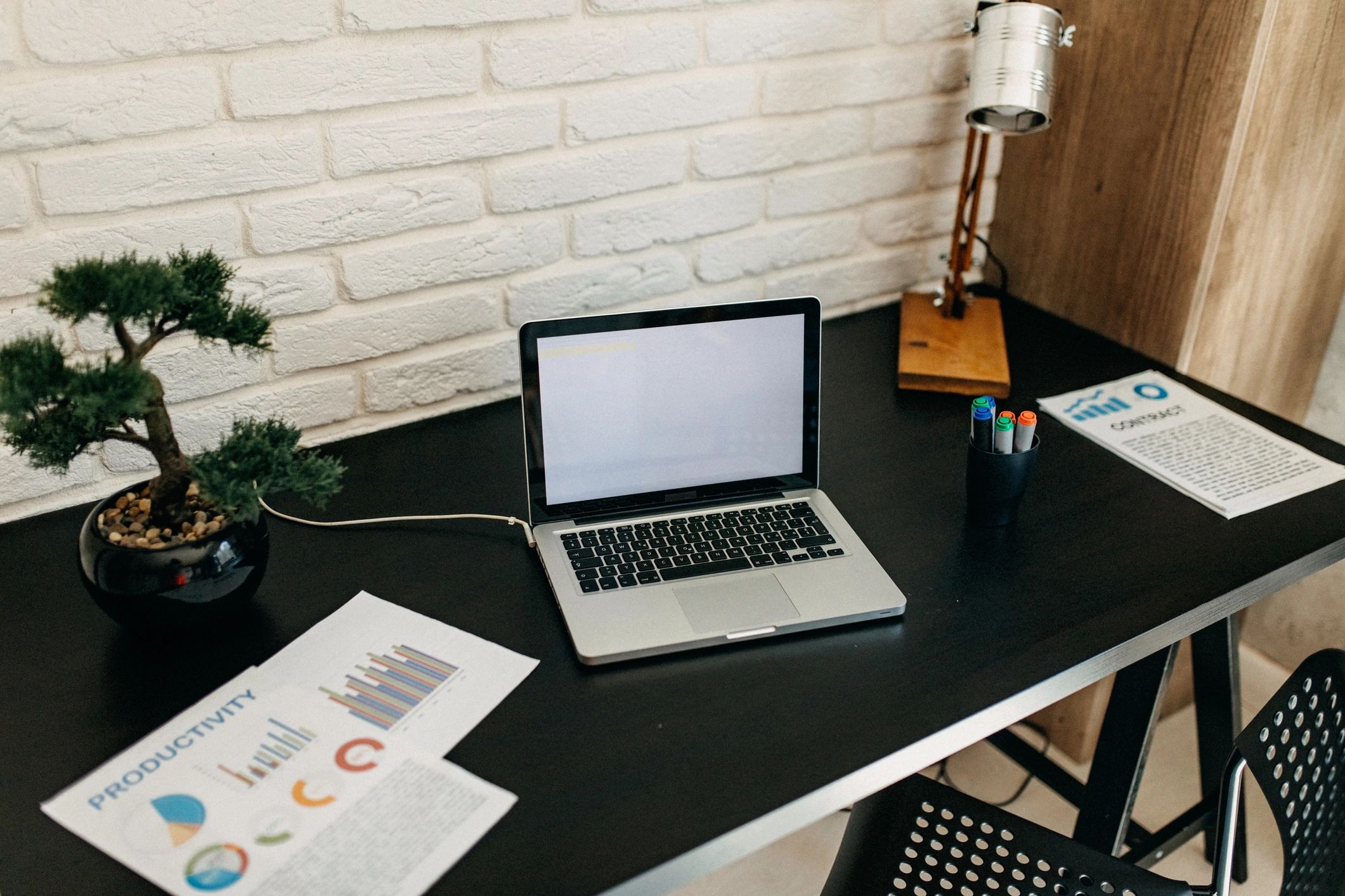 Website design workspace with screens and creative tools