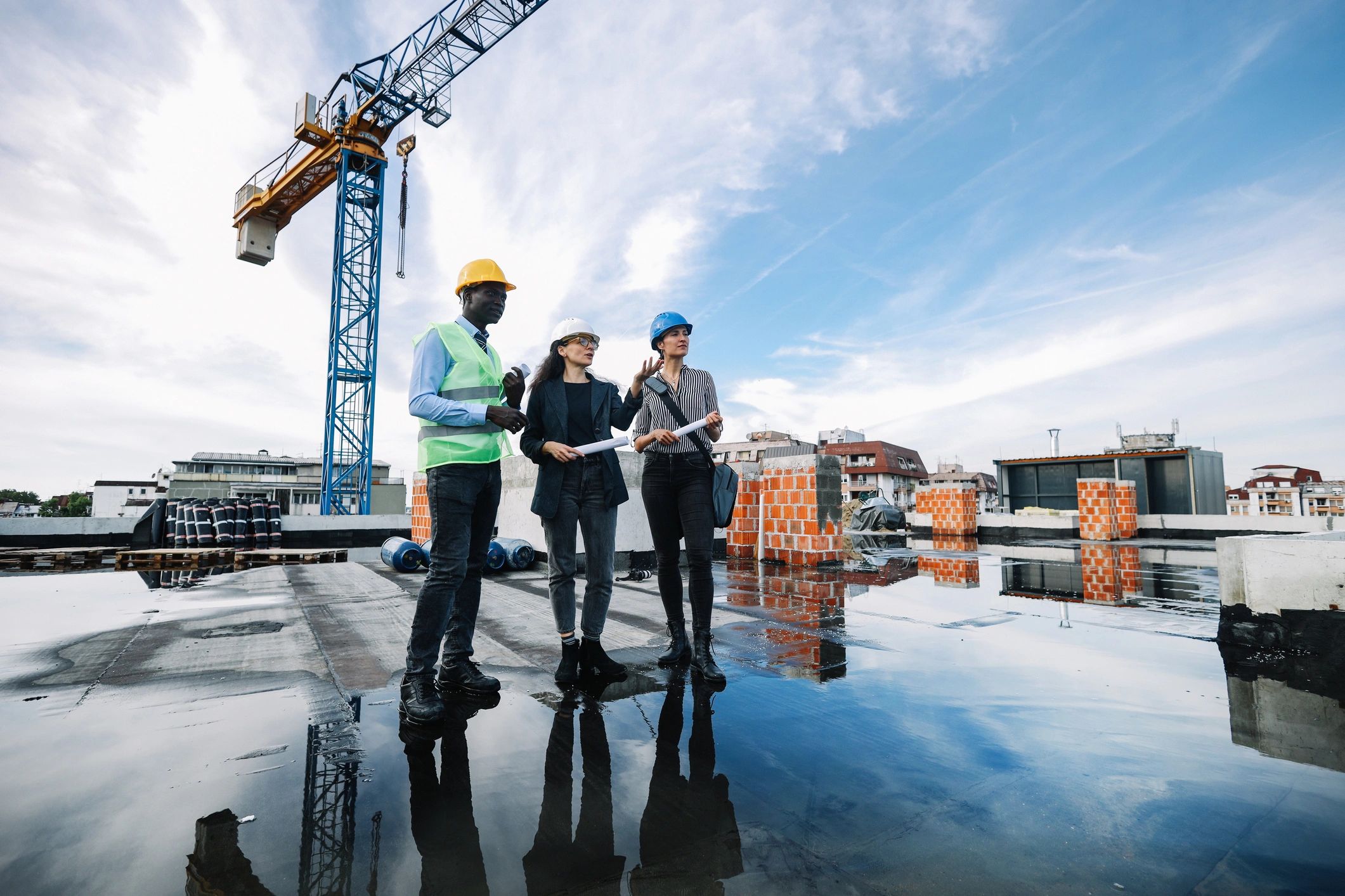 Construction professionals meeting on an active job site