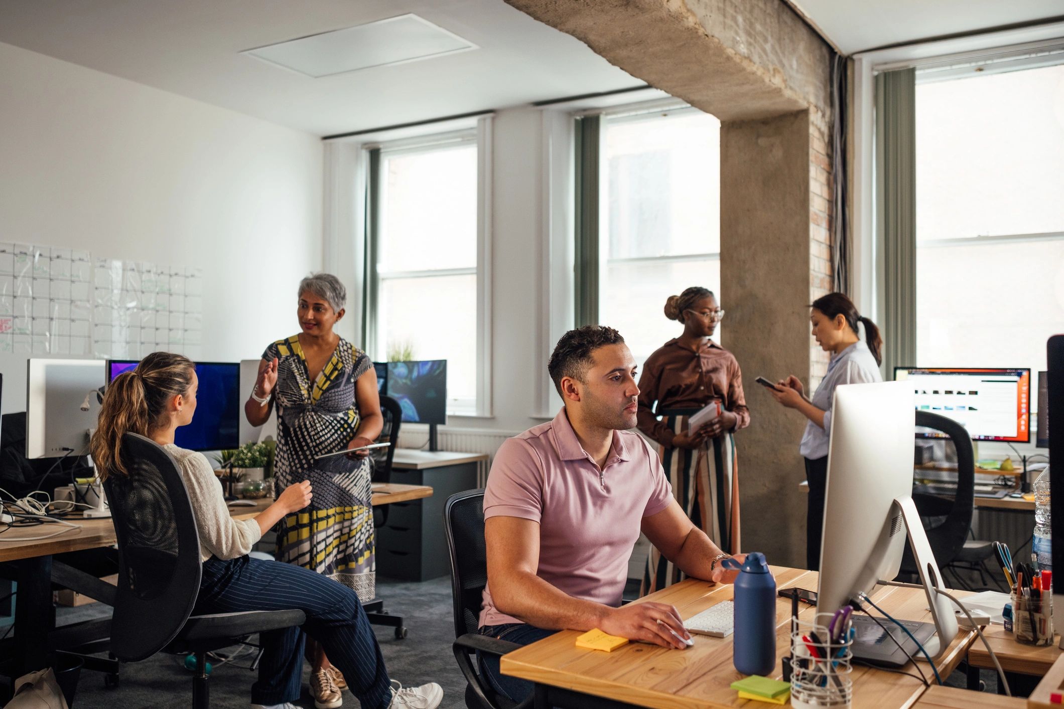 Creative digital agency team working together in an office