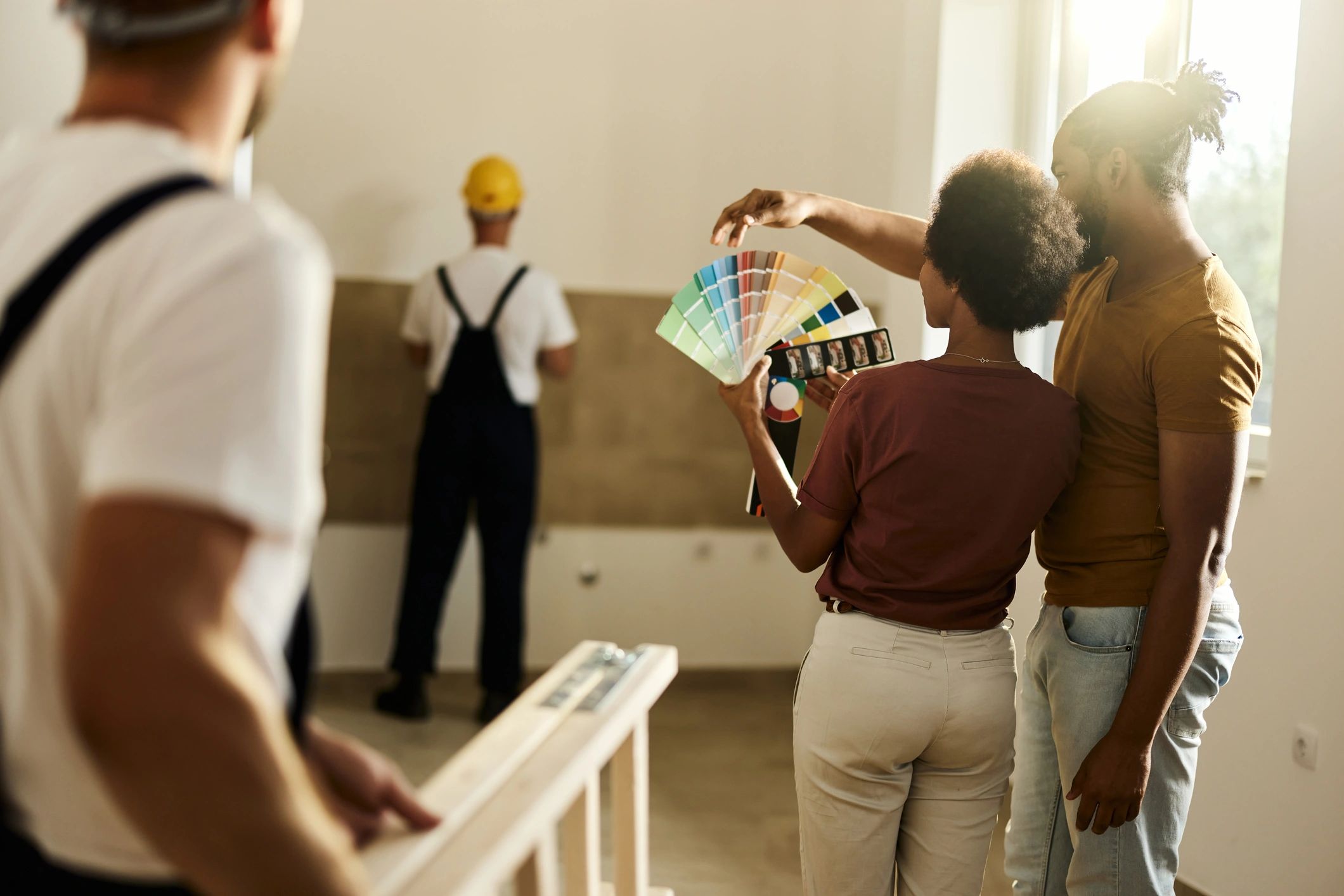 Home renovation team collaborating with homeowners