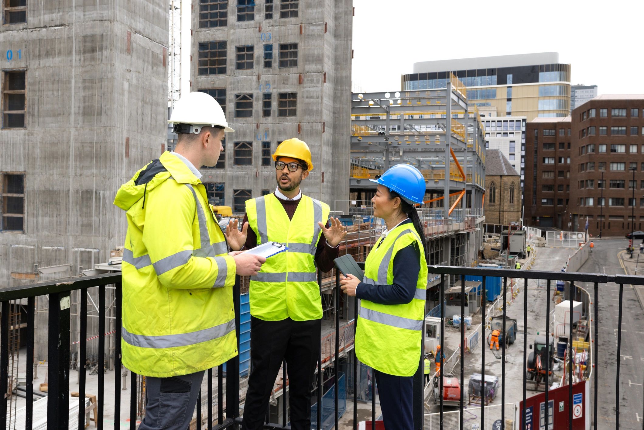 Construction team reviewing project plans on site